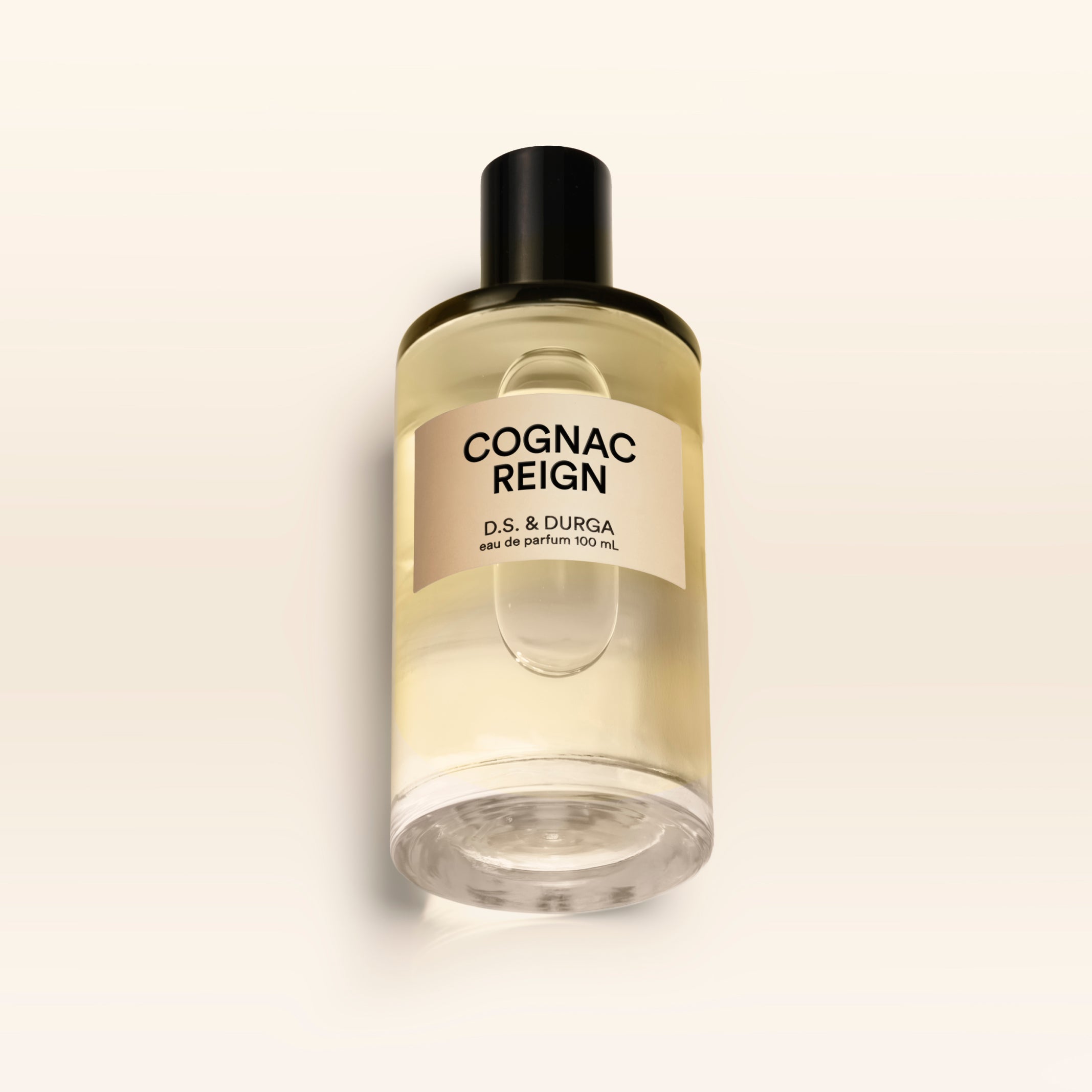 A 100 mL bottle of Cognac Reign perfume.