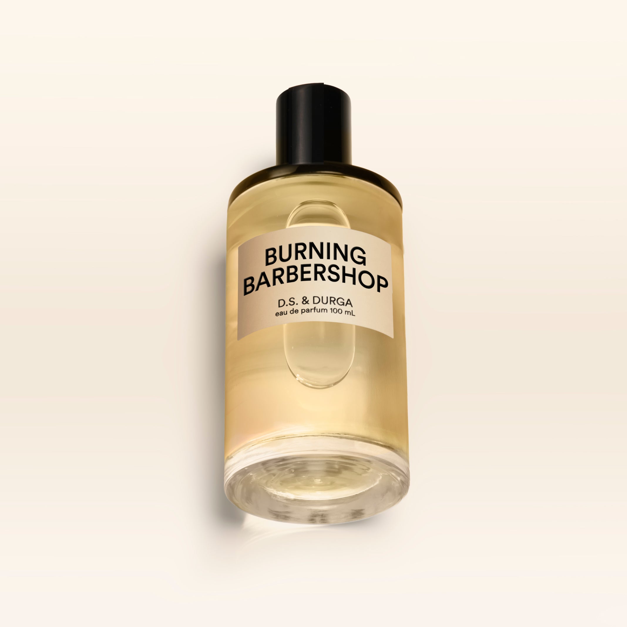 A 100 mL bottle of Burning Barbershop perfume.