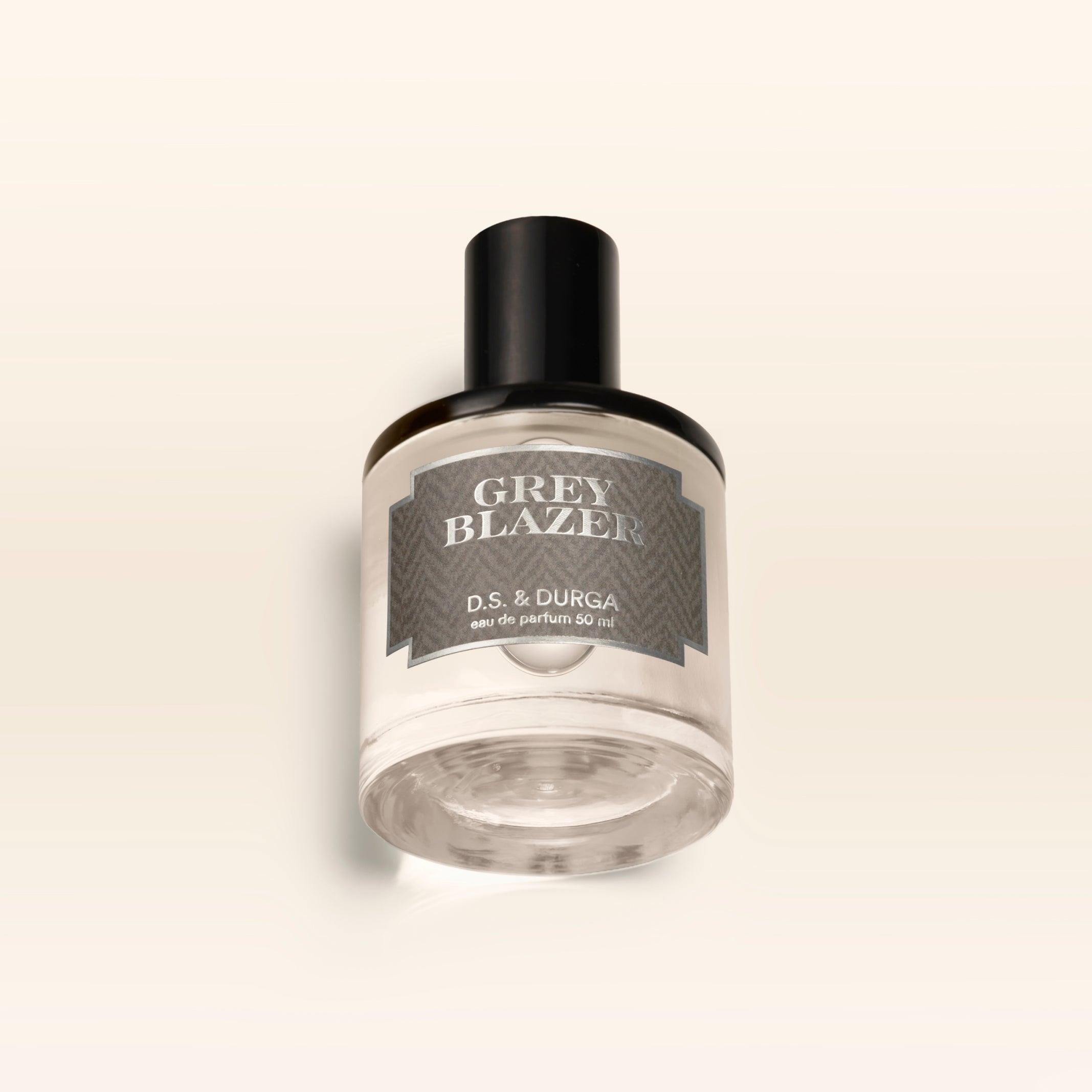 A 50 mL bottle of Grey Blazer perfume