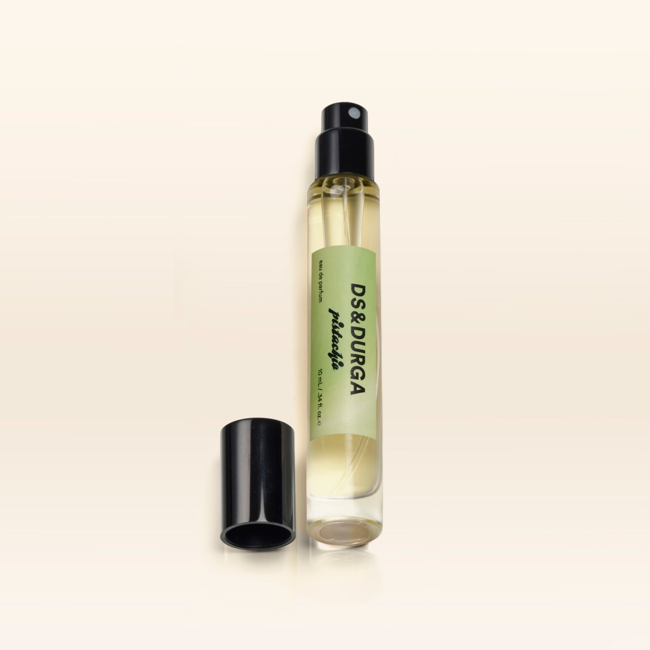 A travel size bottle of Pistachio perfume